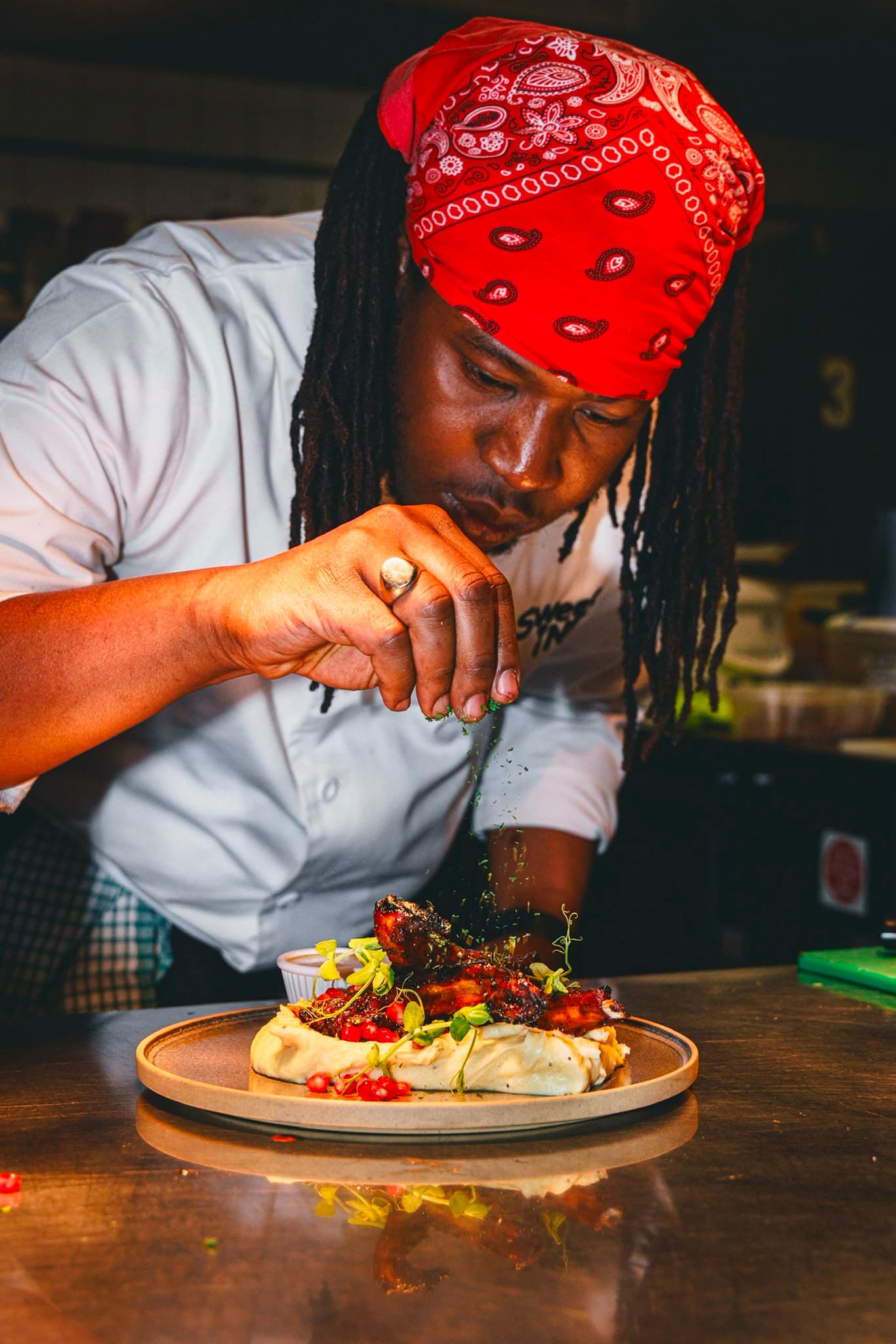 Chef finishing lamb at Sweet1NE